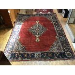 A 1920s North Persian rug, the centre diamond shaped medallion with enclosed lotus flower and leaf