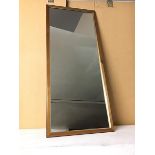 A modern wall mirror with wooden frame (92cm x 39cm)