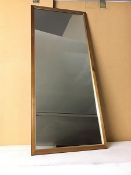 A modern wall mirror with wooden frame (92cm x 39cm)