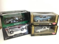 A collection of diecast cars including a Guiloy, Aston Martin and Mercedes, and an ERTL Jaguar and