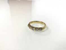 An 18ct gold five stone diamond ring (O) (3.82g)
