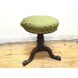 An early 20thc circular stool, the upholstered seat with fleur de lys decoration, on a turned