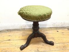 An early 20thc circular stool, the upholstered seat with fleur de lys decoration, on a turned