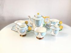 An Aynsley china 1920s/30s nine piece breakfast set including two cups, two saucers, side plate, two