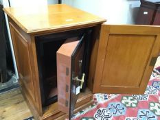 A 1900/1920s Colonial chest style safe, complete with original oak storage cabinet, "Not designed to