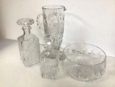 An assortment of glass including two decanters, a bowl, and a large footed ewer (30cm x 21cm x 12cm)