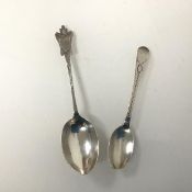 Canada Interest: a silver teaspoon stamped with a Georgian head and maple leaf, possibly makers mark