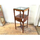 A George III mahogany washstand, the square top with basin aperture, tooth spill aperture and