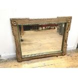 A 1920s/30s bevelled glass wall mirror within moulded and painted frame (100cm x 78cm)
