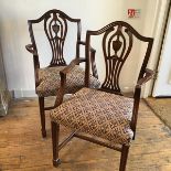 A pair of Sheraton style urn and pierced splat back open side chairs with stuffover seats, on fluted