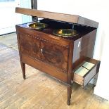 A 19thc mahogany washstand, the rectangular hinged top enclosing a fitted interior complete with two