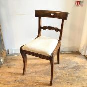 A Scottish Regency mahogany side chair with curved top rail and scroll back, with inset seat, raised