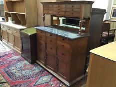 A French walnut buffet, the top with an arrangement of three sets of drawers, raised on turned