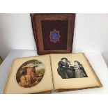 An Edwardian scrap book with an assortment of prints, some coloured (binding a/f)