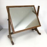 An Edwardian mahogany hinged dressing table mirror, the rectangular frame with boxwood inlay, on