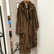 A full length fur coat with an Ornstein Furs, Chicago label to interior (shoulders: 31cm)