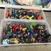 A large collection of toy figures including Batman, He Man, Power Rangers, Spiderman etc. (a lot)