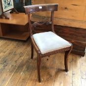 A Scottish Regency mahogany side chair with curved top rail and scroll back, with inset seat, raised