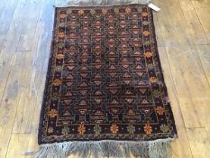 A Nomadic Kurdish style rug, the centre panel with allover stepped and diamond interlocking