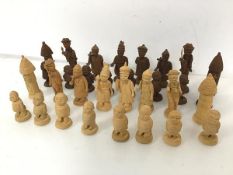 A set of Nigerian hand carved wooden chess pieces, some losses (tallest: 9cm)