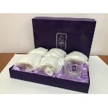 An Edinburgh Crystal presentation set of six whisky tumblers, unused in original tissue, complete
