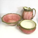 A Victorian majolica wash basin, of naturalistic form, in pinks and greens (46cm x 13cm x 39cm),