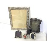A collection of silver photograph frames (largest: 30cm x 24cm) (6)