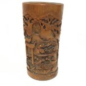 A Japanese rootwood carved brush washer with relief carved figure scenes, signed (h.24cm x 12cm)