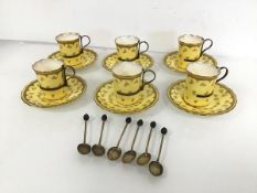 A set of six Edwardian Coalport coffee cans, with primrose yellow ground and gilt decoration, each