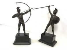 A pair of spelter Classical warrior figures, one with bow and arrow, the other spear and shield,