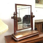 A Victorian mahogany hinged dressing table mirror, the rectangular glass between two turned