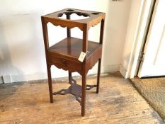 A George III mahogany washstand, the square top with circular wash bowl aperture and twin beaker