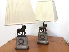 A pair of Napoleonic style marble lamps with cast bronze Roman style horses, the lamps mounted