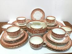 A thirty eight piece English Edwardian china tea service with burnt umber transfer printed foliate