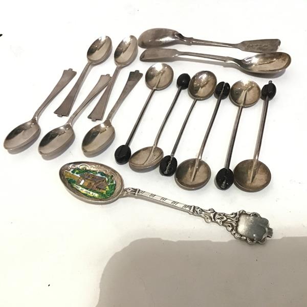 A collection of miscellaneous spoons including five Sheffield silver coffee spoons, six Chester
