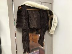 A fur shawl, embroidered with Karter to interior (shoulders: 34cm) with another shawl and a white