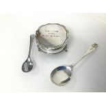 A 1915 Birmingham silver footed jewellery box (3cm x 6cm), a London silver spoon and an Epns