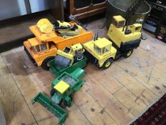 A collection of Tonka metal digger toys including a dump truck (26cm x 46cm x 21cm), bulldozer,