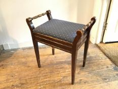 An Edwardian stained beech box top piano stool, the hinged top with upholstered blue and diamond