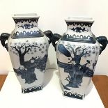 A pair of modern reproduction Chinese porcelain style vases of square tapered form with elephant