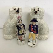 A pair of 19thc Staffordshire chimney spaniels (26cm x 16cm x 8cm), a Staffordshire figure of a