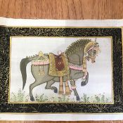 An Indian painting on silk depicting a Horse in Ceremonial dress, with handpainted border (22cm x