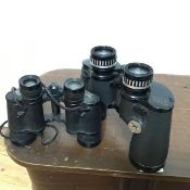 A pair of Hunter binoculars (16cm x 19cm x 8cm) and another pair of Baker Standard binoculars (2)