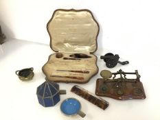 A mixed lot including a mid 20thc. set of three enamel and metal ashtrays, housed within a pavillion