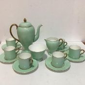 A Wedgwood china fifteen piece demi tasse coffee set with celadon green ground and gilt borders
