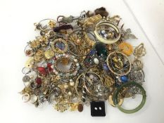 A large assortment of costume jewellery including bangles, bracelets, rings, brooches etc. (a lot)