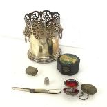 A mixed lot including a tall Epns wine coaster with fretwork and lion mask handles to sides (16cm