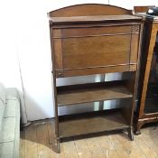 An oak Arts & Crafts bureau, the fall front opening to a fitted interior with pigeonholes and ink