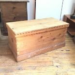 A 19thc stripped pine kist, with hinged top and plinth base, lock mechanism removed (a/f) (49cm x