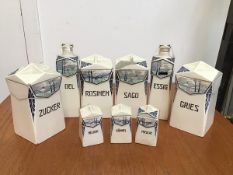 A collection of Jena Annaburg 1930s storage jars and bottle flasks including Oil, Sego, Sugar